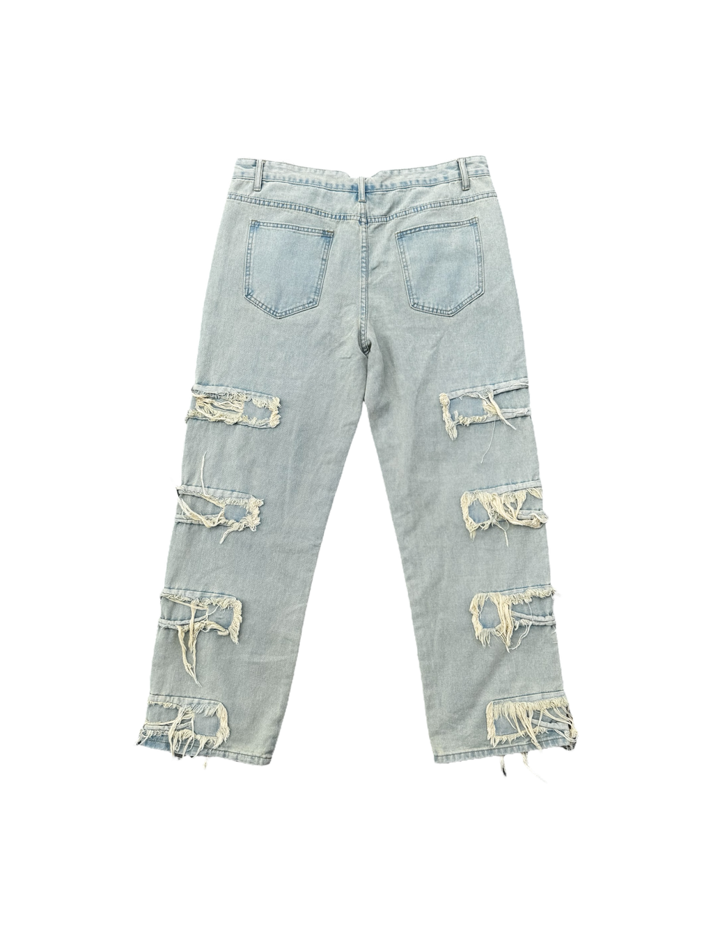 Cream / light wash distressed denim jeans