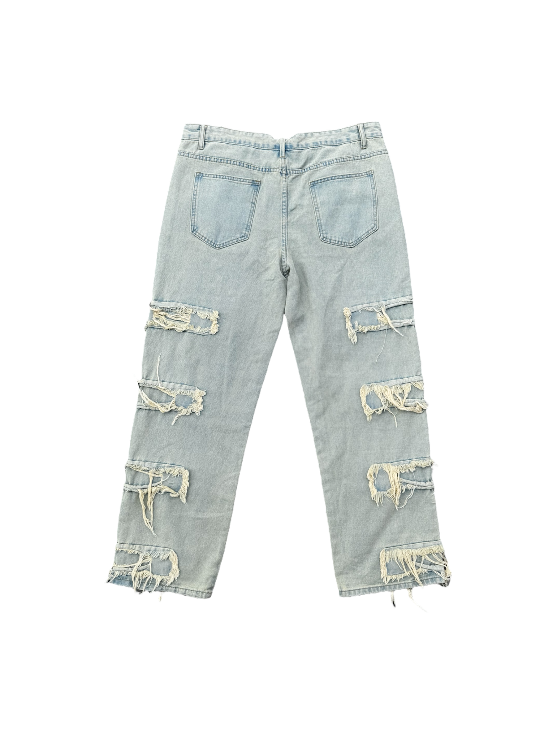 Cream / light wash distressed denim jeans