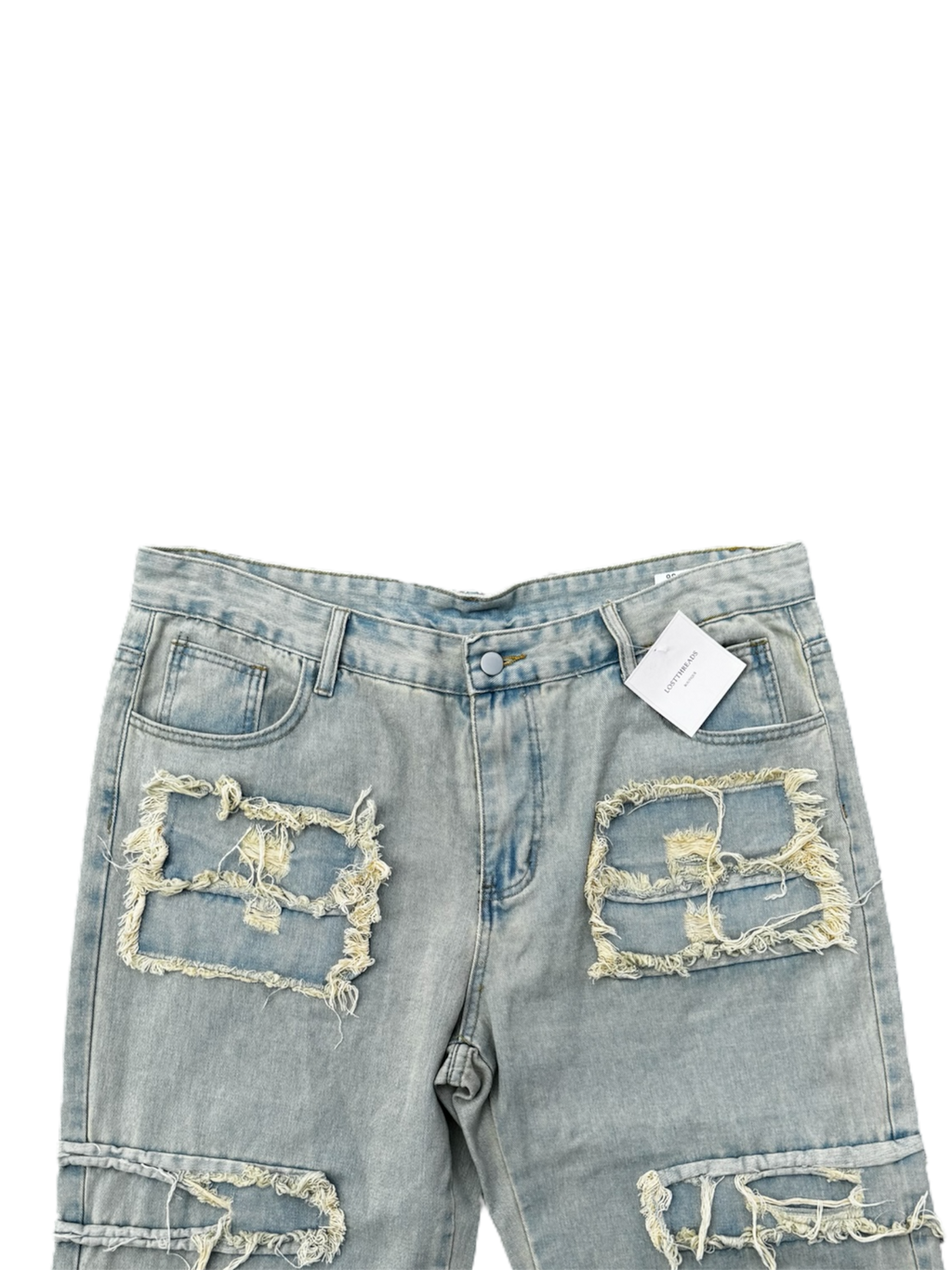 Cream / light wash distressed denim jeans