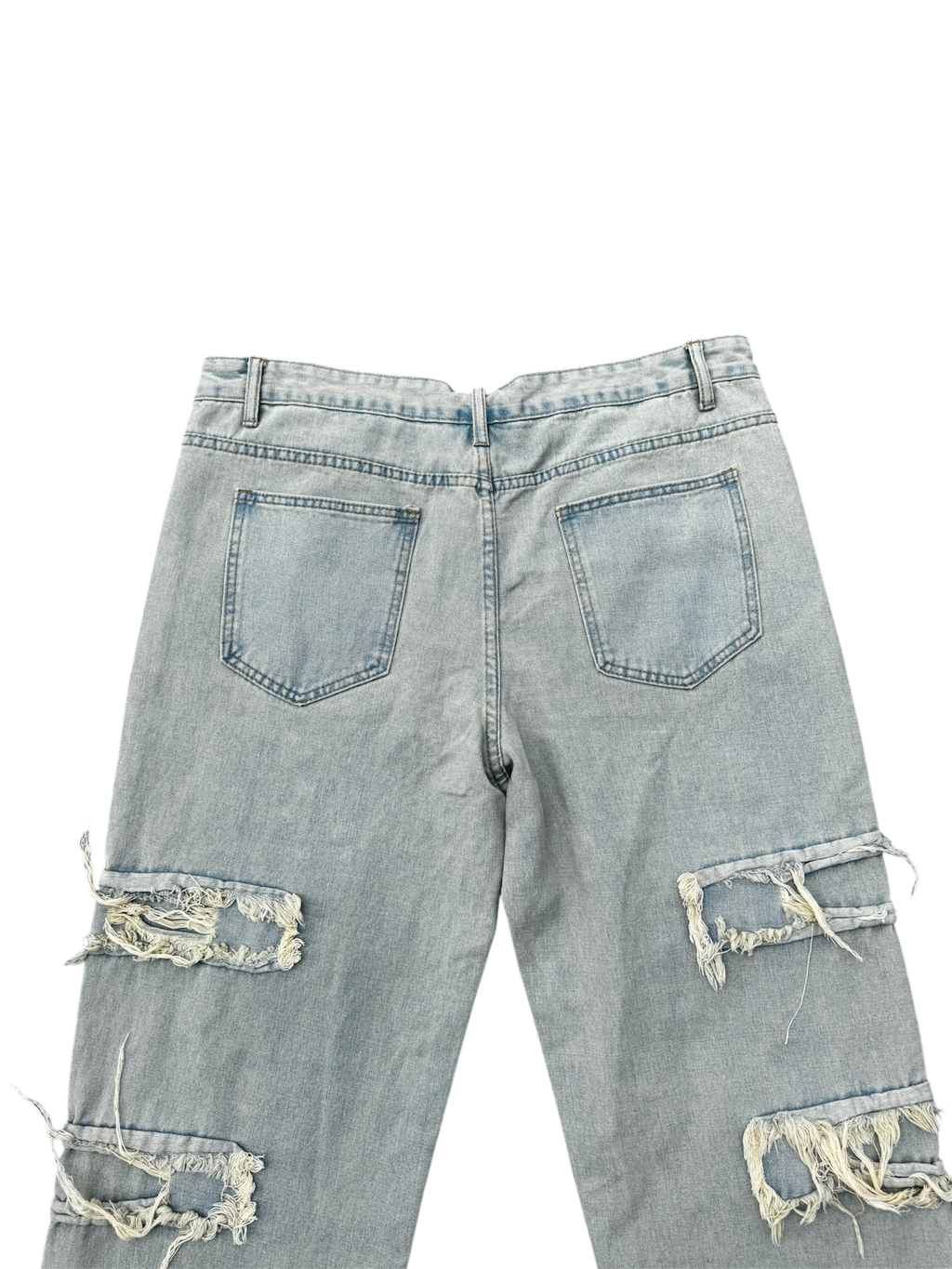 Cream / light wash distressed denim jeans