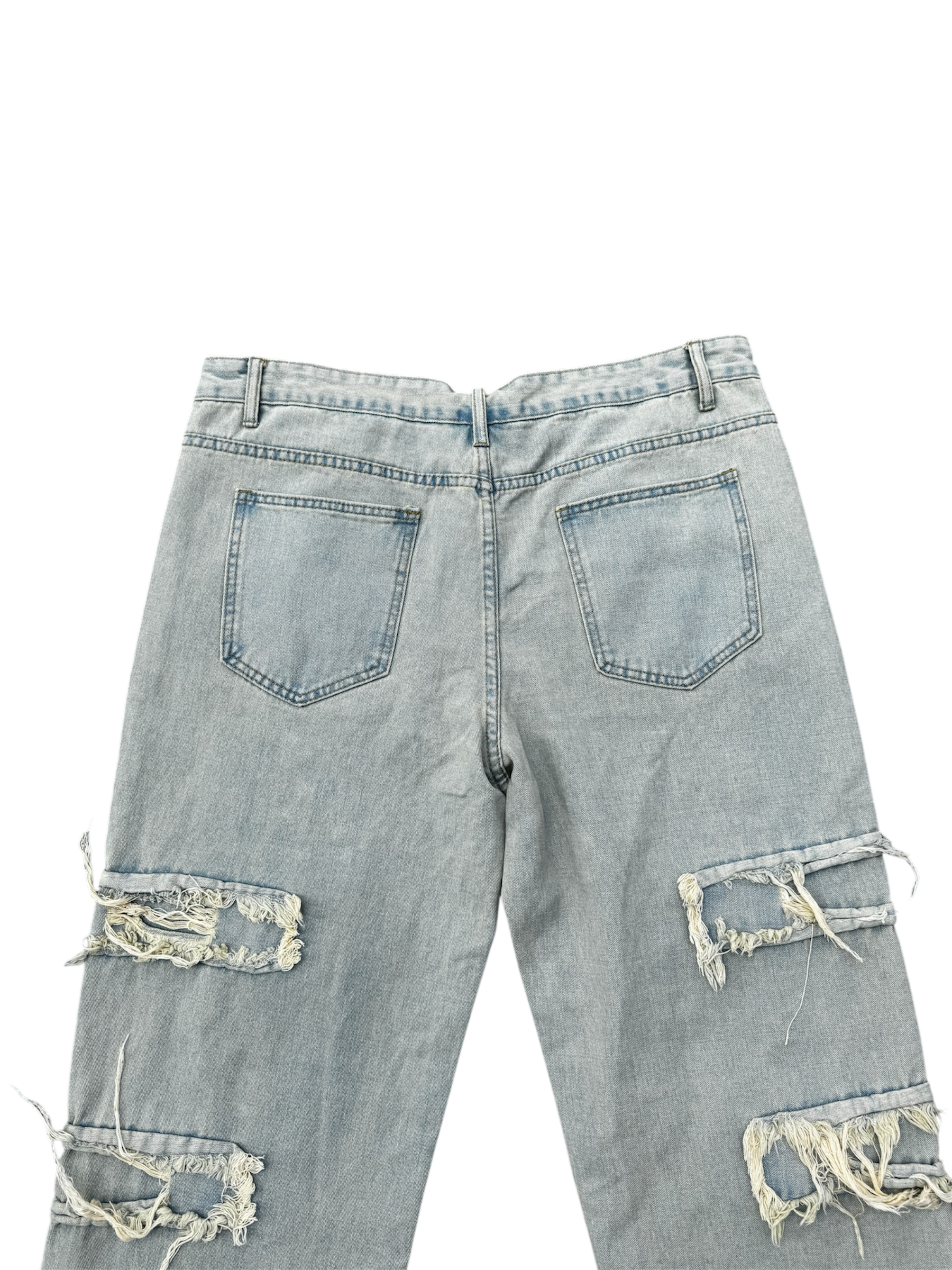 Cream / light wash distressed denim jeans