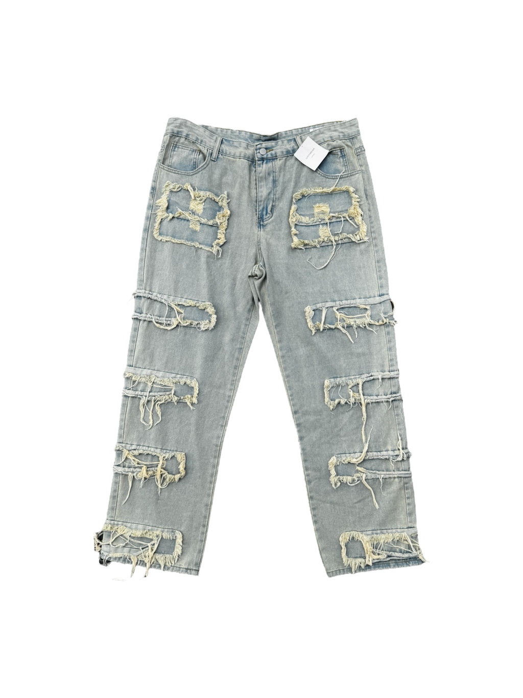 Cream / light wash distressed denim jeans