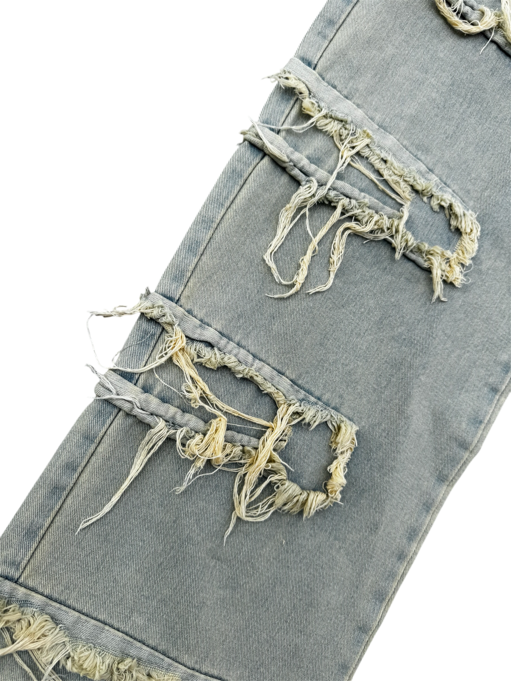 Cream / light wash distressed denim jeans