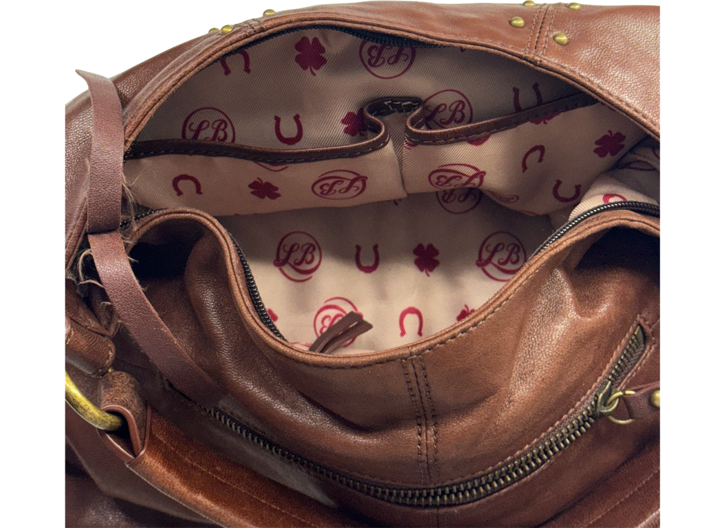 Brown hobo style studded leather bag